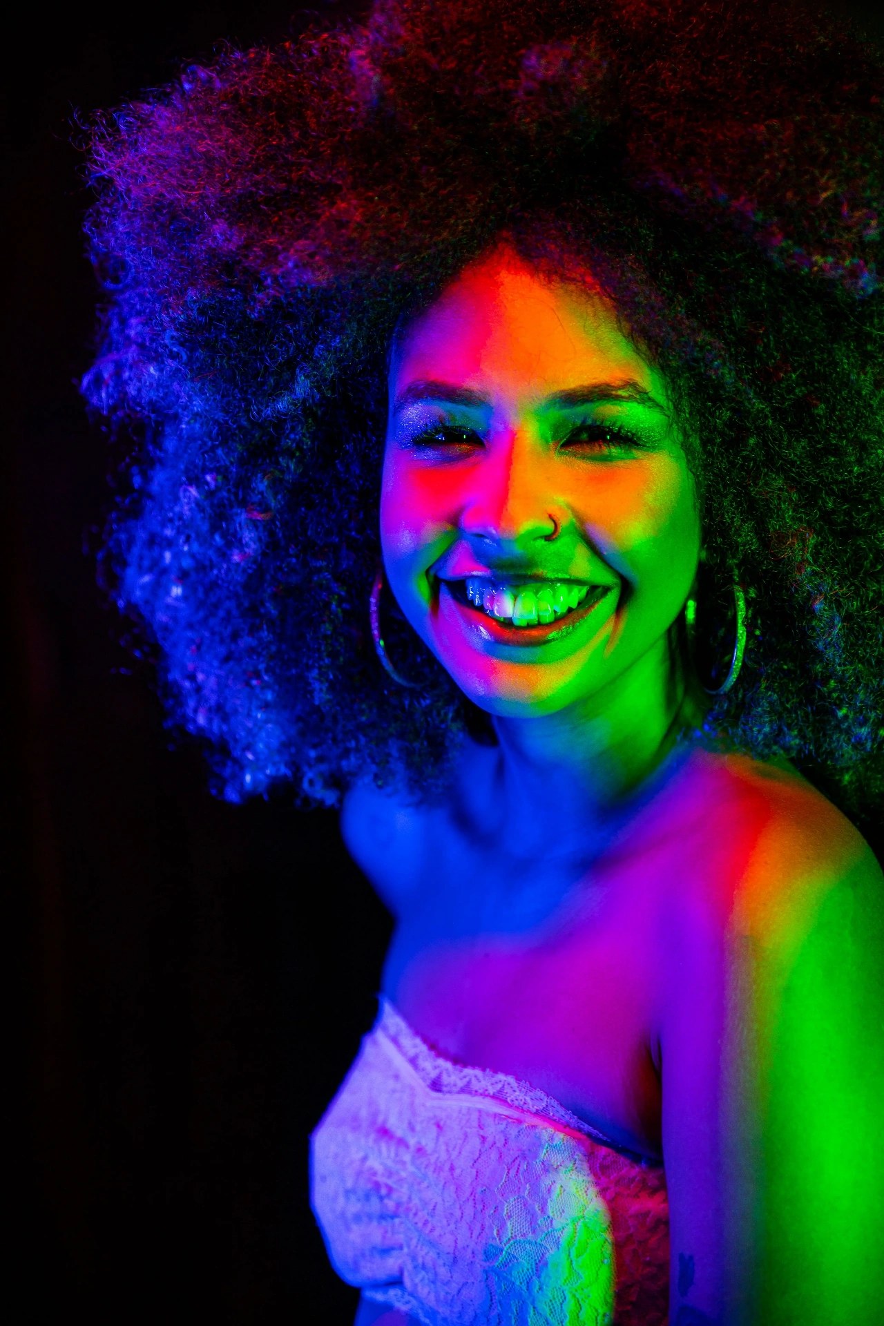 Portrait fractured by red and green gel light